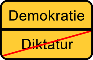 Schild Demokratie - Diktatur